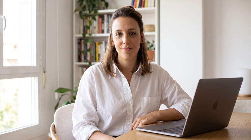 Maria Madeira, growth consultant, at her desk